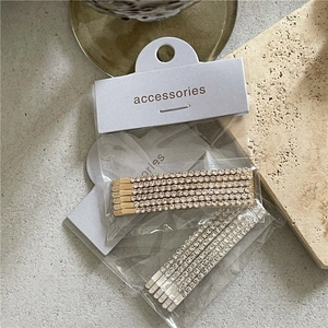 Silver and gold rhinestone hair clip set featuring ten pieces on elegant cards