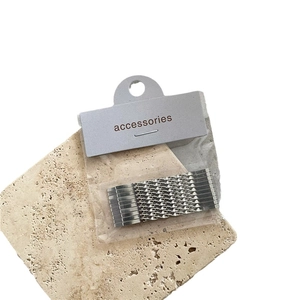 Silver metal twisted hair clips set on stone display board for girls everyday styling