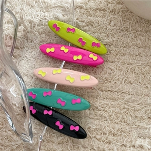 Five-piece colorful bow hair clip set in vibrant contrast shades for women and girls