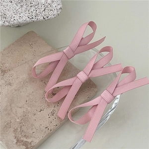 Three-piece set of elegant pink fabric bow hair clips for women in minimalist style