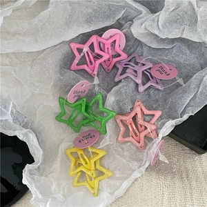 Glittering star hair clips set in pink purple green yellow colors with tags