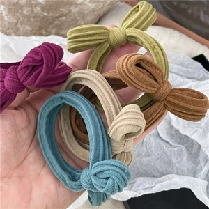 Set of 5 colorful knitted bow hair ties in purple, green, brown, beige and blue