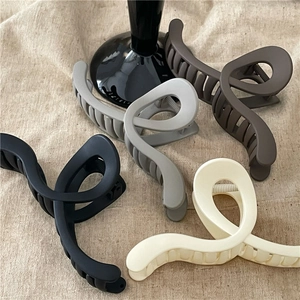 Minimalist matte large twisted hair claw clips in neutral Morandi colors for women