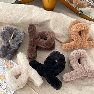 Plush cross hair claw clips in warm milk coffee tones for autumn winter hairstyles