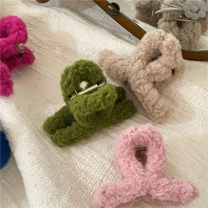 Sweet cream colored plush crisscross hair claws in various soft pastel colors