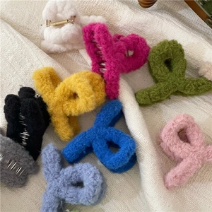 Top view of plush faux fur hair claw clips in various pastel and vibrant colors