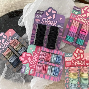 Kids seamless elastic hair ties set in colorful macaron shades on brand card