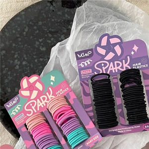 Set of colorful and black elastic hair bands for children in baby size card packaging