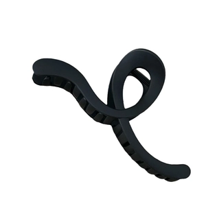 Minimalist matte black geometric hair claw clip with elegant twisted loop design
