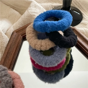Colorful plush hair scrunchies set in cream tones made of soft faux mink fur fabric