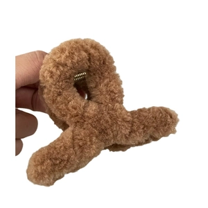 Brown plush hair claw clip with soft fabric texture and durable golden metal spring