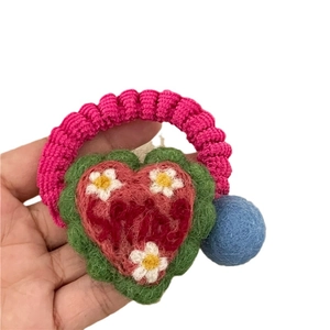 Handmade crochet heart hair tie with colorful wool balls and Smile embroidery