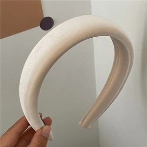 Close-up of thick velvet padded headband in cream white for high cranial top look