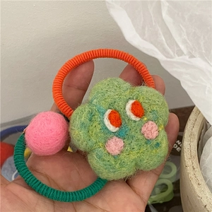 Handmade green felt flower hair tie with eyes and pink pom pom for cute girls