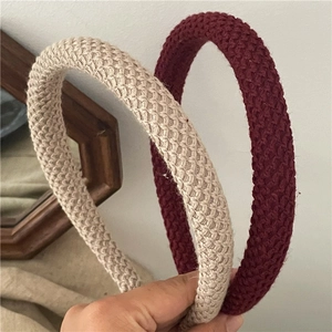 Thick knitted headband set in beige and burgundy colors with chunky cable knit texture