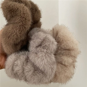 Detailed close-up showing soft plush texture of oversized faux mink fur hair scrunchies
