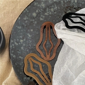 Detailed close-up of textured flocking cloud BB hair clips in earthy neutral tones
