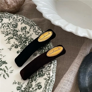 Retro velvet rectangle hair clips in black and brown with golden handmade metal label