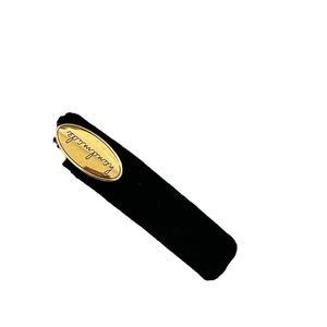 Retro black velvet hair clip with oval golden handmade label for vintage styling