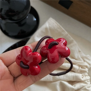 Set of two cute red flower hair ties with shiny resin petals and high-elastic brown bands