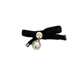 Elegant black knitted bow hair clip with gold logo charm and white pearl drop pendant