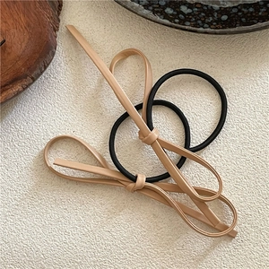 Minimalist PU leather bow hair ties in black and khaki for women ponytail styling