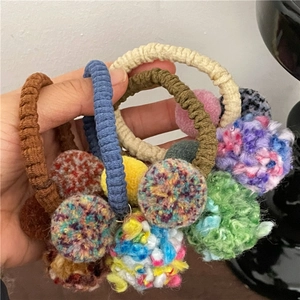 Sweet pom-pom hair ties in various colors featuring plush mix texture for ponytails