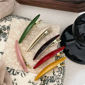 Elegant leaf-shaped acetate hair clips set in six assorted vibrant high-gloss colors