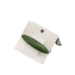 Elegant dark green acetate willow leaf hair clip on white card with golden French lettering