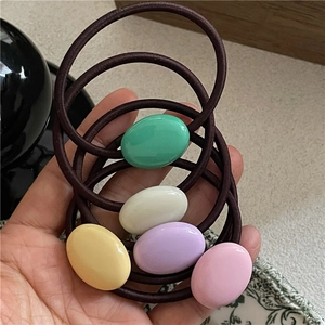 Five-piece set of cream-colored pebble hair ties in soft macaron resin shades