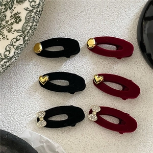 Set of six velvet oval hair clips with golden heart and rhinestone bow decorations
