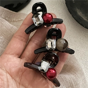 Mini hair claws set with luxury crystals and red beads for side fringe styling