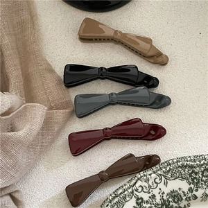 Five Morandi plastic bow banana clips for women ponytail styling in various colors