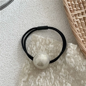 Detail of high-elasticity double-strand hair tie with large white faux pearl bead