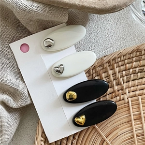 Lot de 4 barrettes à cheveux minimalistes noires et blanches avec motifs cœur et ovale
