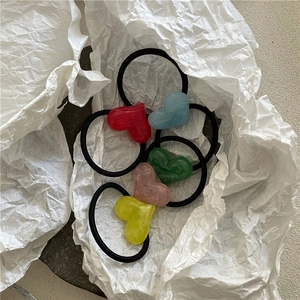 Set of five colorful heart-shaped elastic hair ties with marble texture acrylic accents