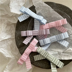 Set of four plaid bow hair clips in pastel pink, blue, purple and green fabric