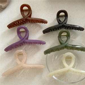Set of six colorful jelly texture hair claw clips with cross geometric design