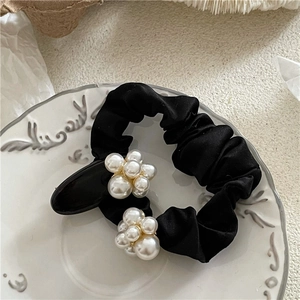 Elegant black satin scrunchie and hair clip set with faux pearl flower embellishments