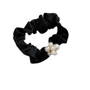 Elegant black satin hair scrunchie with white pearl flower decoration for women