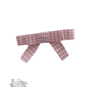 Sweet pink gingham plaid bow hair clip for girls with a classic preppy style design