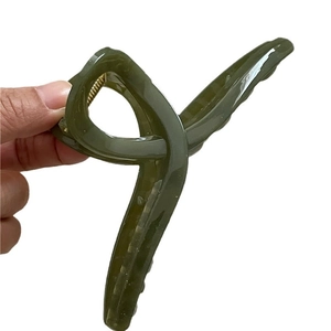Minimalist jelly dark green hair claw clip with cross twist design and gold spring