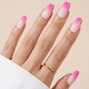 Long coffin-shaped press-on nails with rose pink to milky white gradient glossy finish