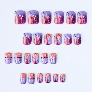 Detail of 24pcs gradient purple and orange press-on nails with silver geometric lines