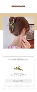Detailed close-up of 11.5cm gold strawberry hair claw clip with pink enamel charms