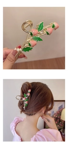 Detailed view of golden strawberry hair claw clip with pink fruit and white pearls