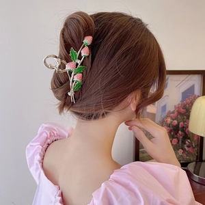 Pink enamel strawberry hair claw clip with pearls on golden base for women's hairstyle