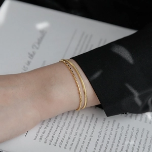 Double-layer gold titanium steel bracelet featuring snake bone chain and bead chain