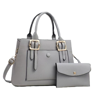 Grey pebbled leather tote bag with matching pouch and golden hardware accents