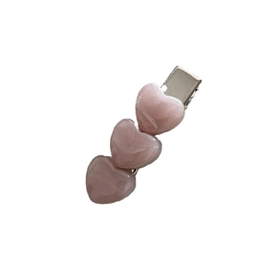 Pink heart hair clip with marble texture and silver metal base for women hairstyle